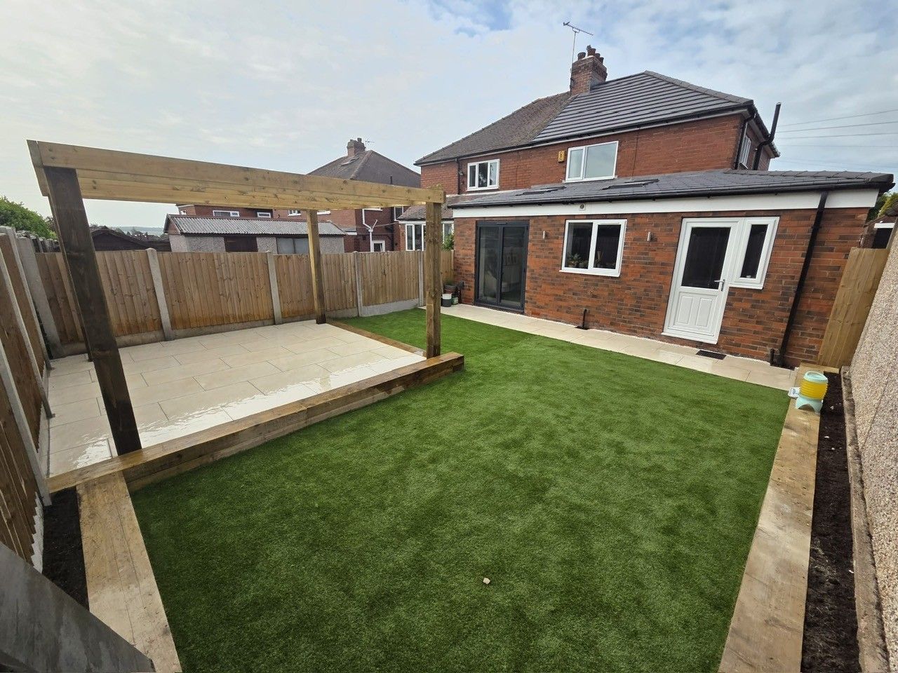 Landscaped garden with pergola and new lawn