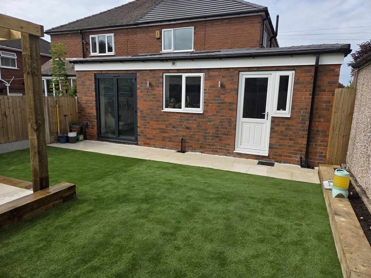 Rear property extension with patio and lawn